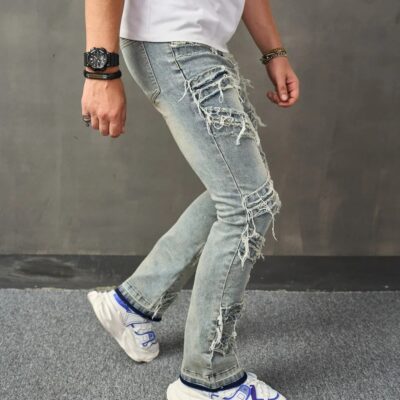 man standing in jeans