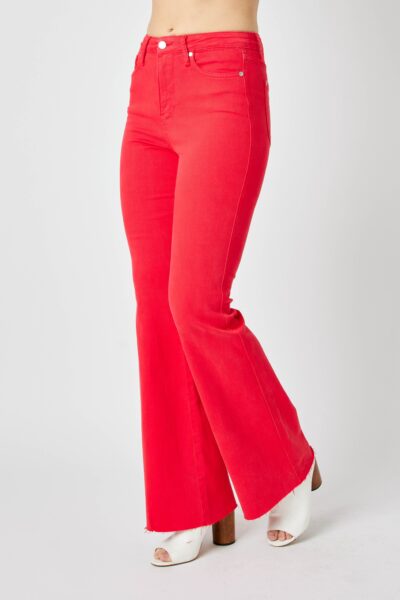 women’s low rise flare jeans in red, raw hem