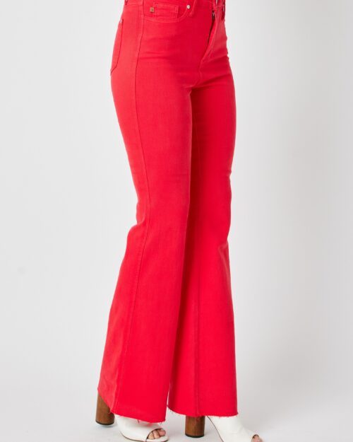 red low rise flared jeans with raw hem, detail close-up